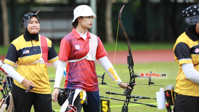 Cung thủ Ánh Nguyệt, Thanh Nhi khoe sắc trong ngày mạc môn bắn cung SEA Games 31 - Ảnh 1.